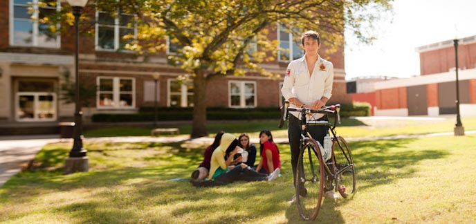 A student with a bicycle