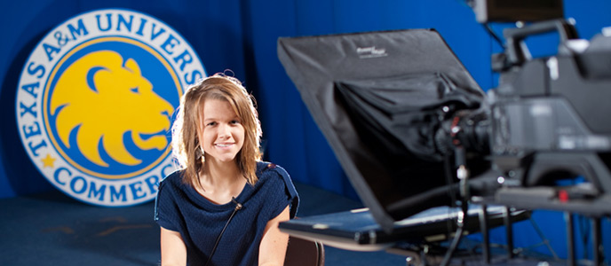 Student sitting in front of a news camera