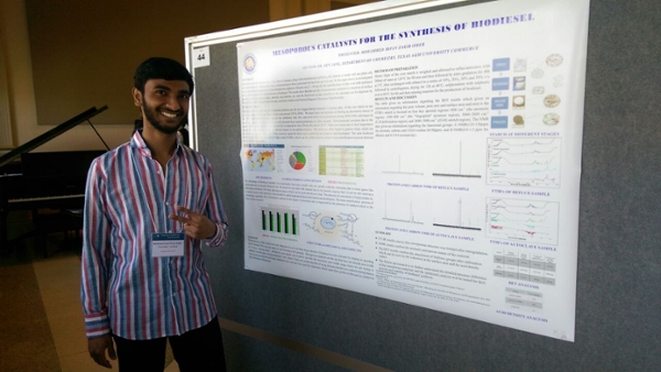 one student presenting a poster