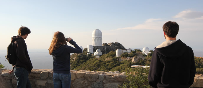 Three students overlook Kitt Peak National Observatory