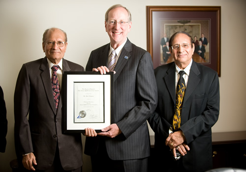 PicturePicture of President Jones presenting certificate to Dr. Chopra