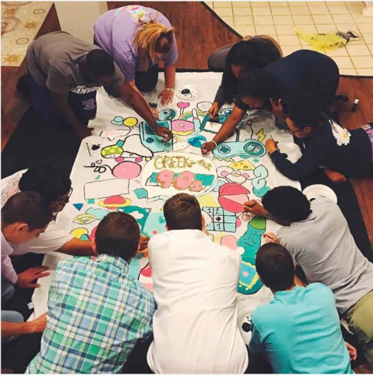 Students coloring together.