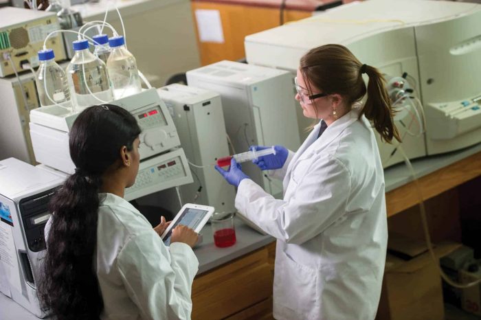 Two students in a chemistry lab