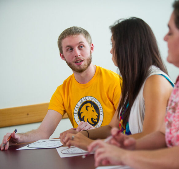 Sociology students speaking with each other.