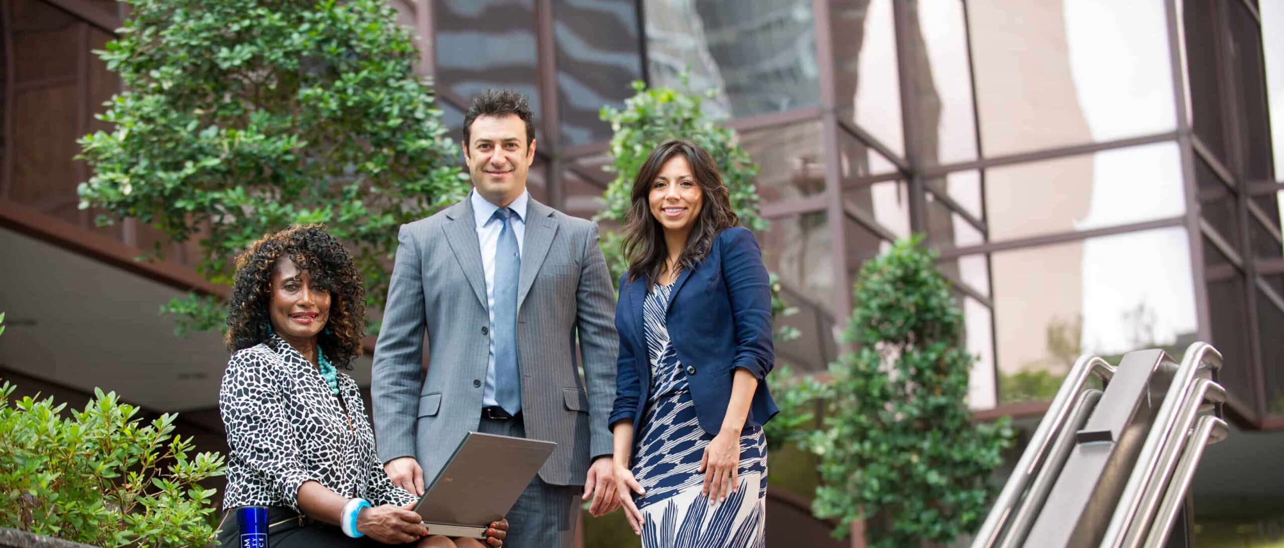 students outside a glass building