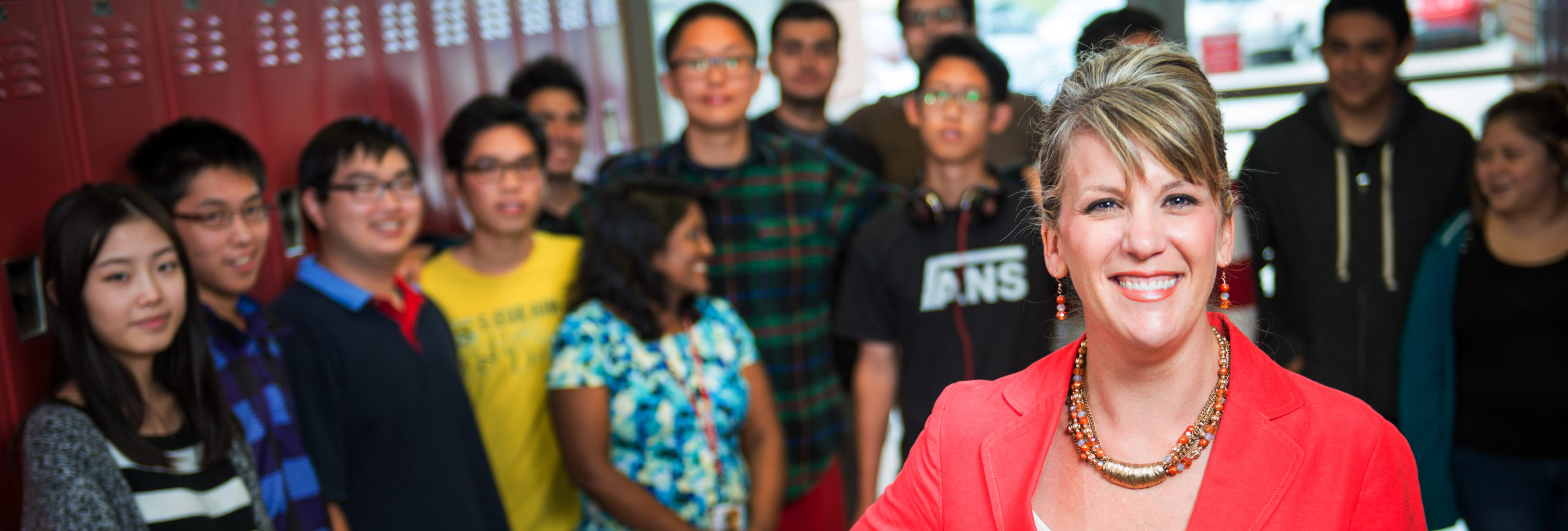 Teacher standing in front of high school students