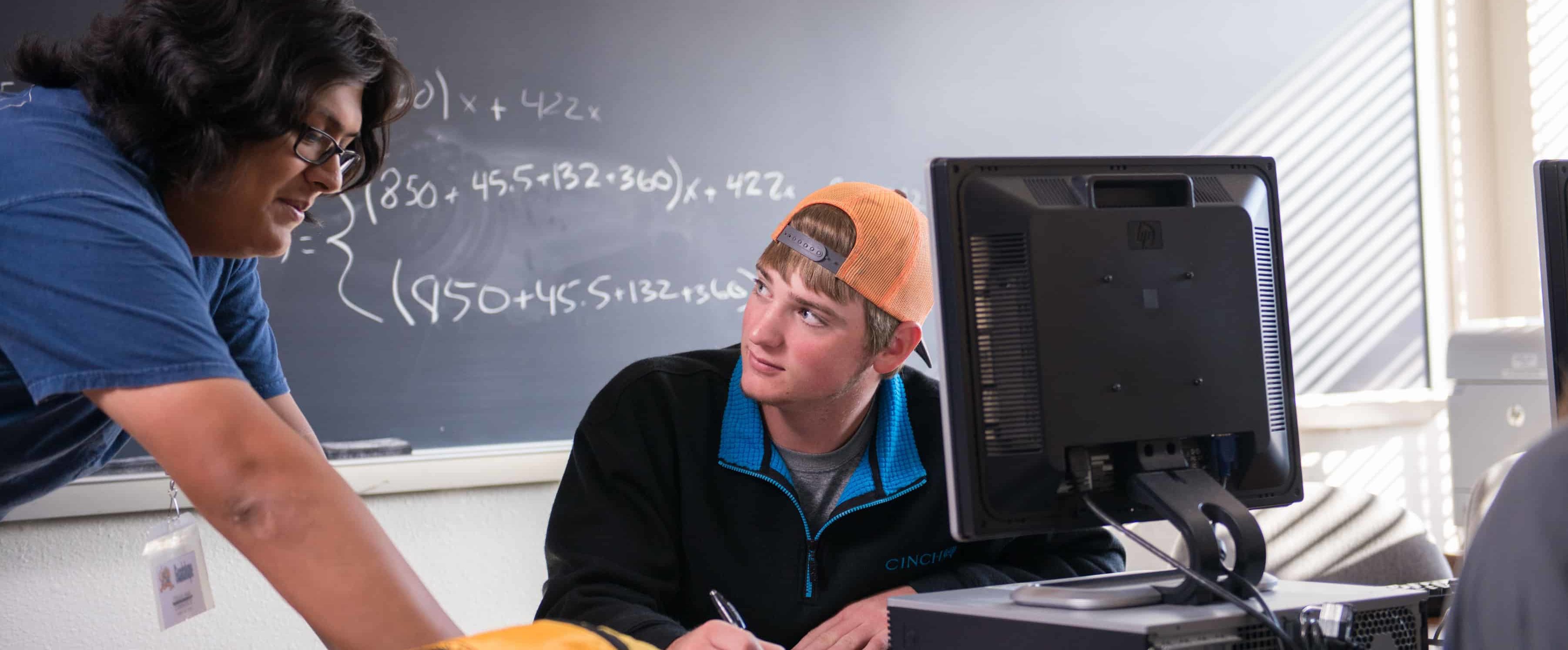 Math instructor helping student