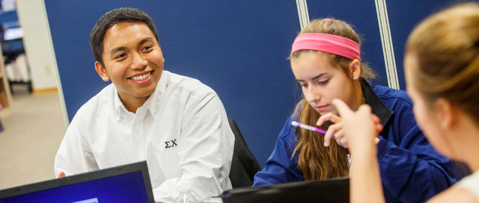 A group of students studying in the library.