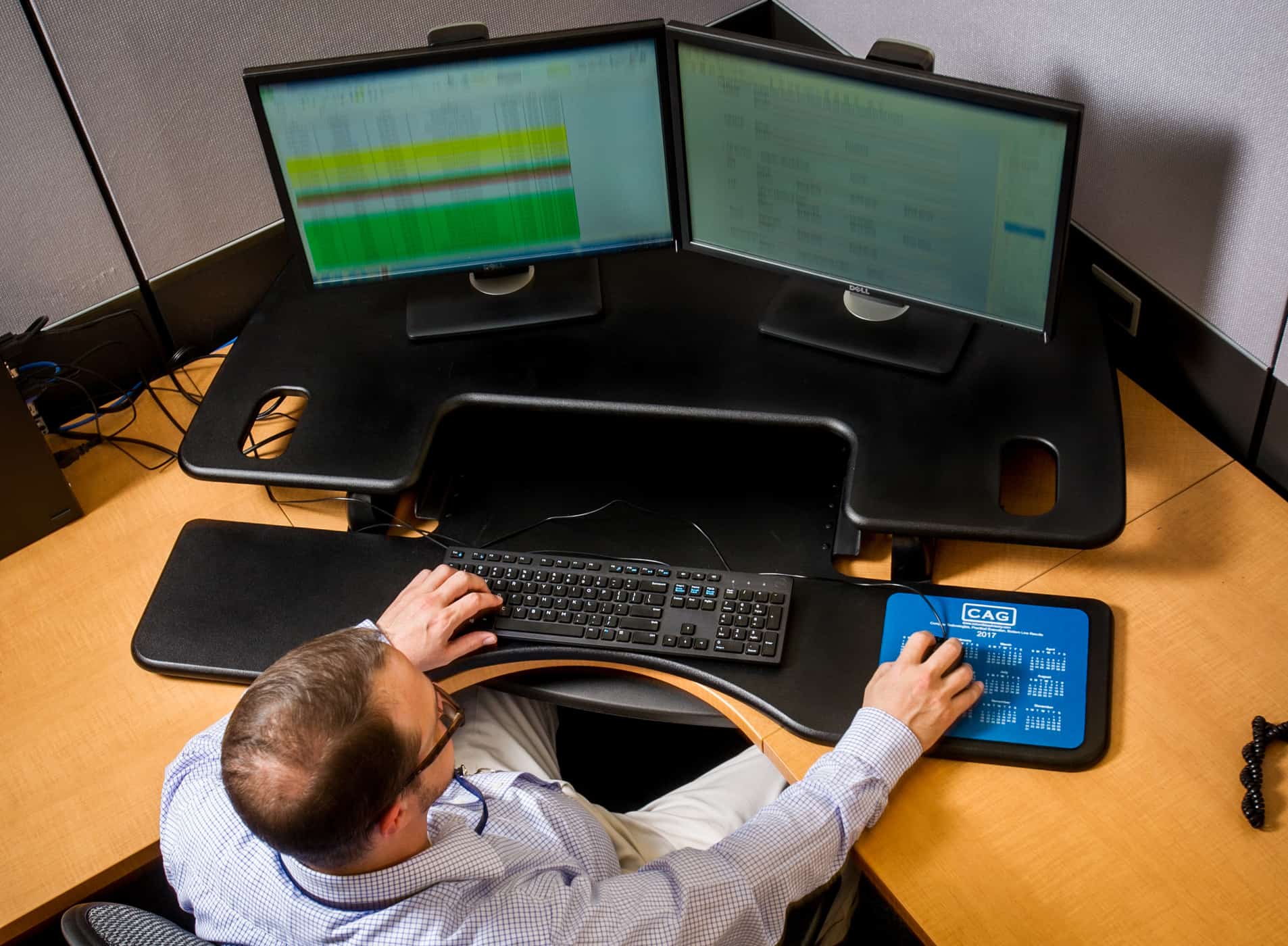 Computer scientist working at several monitors