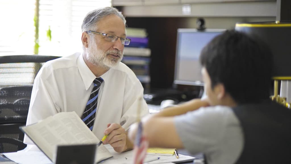 Steve Shwiff speaking with a student