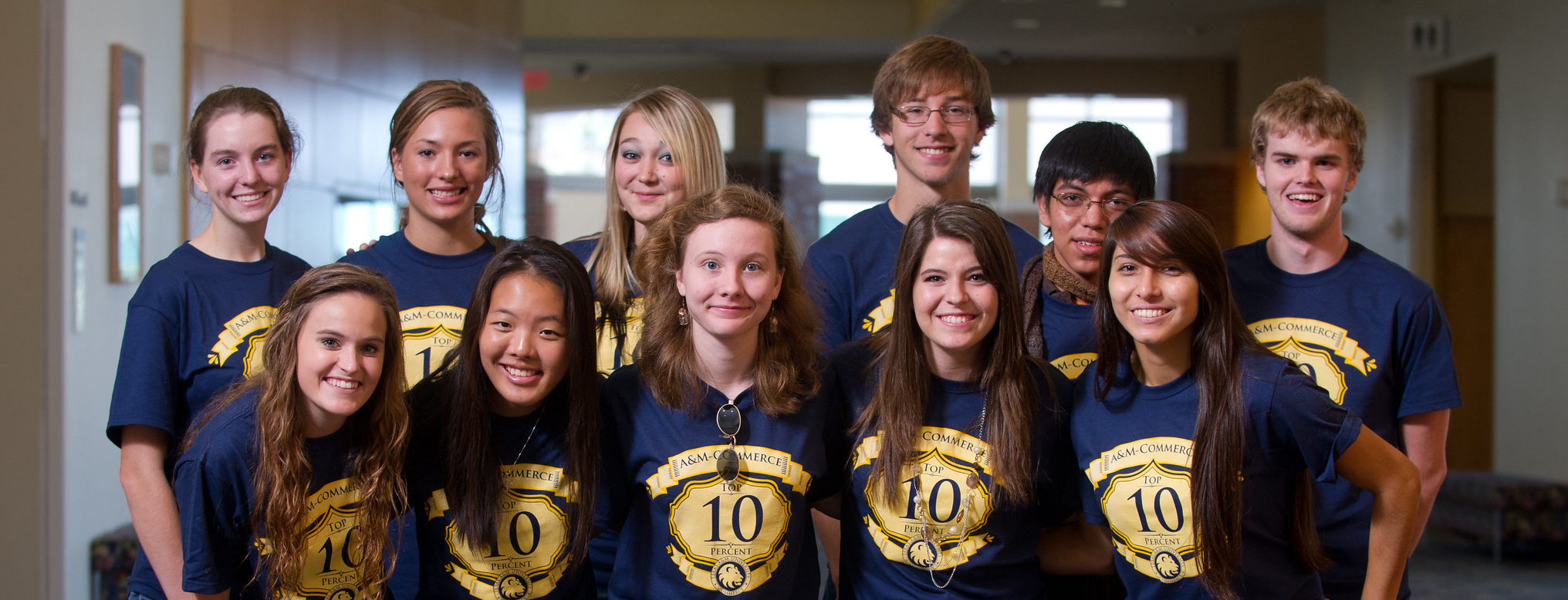 Group of High School students wearing shirts stating Top Ten Percent High School Students.