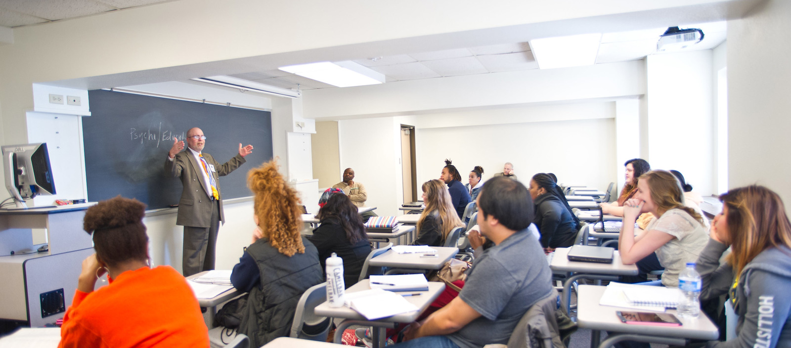 Psychology professor instructing students.