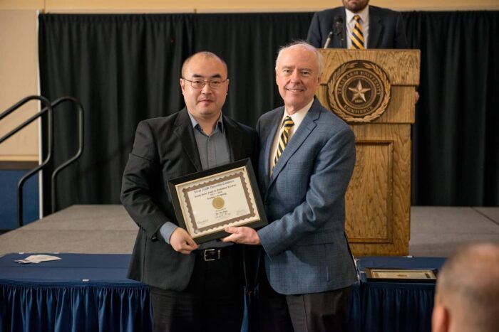 Dr. Bo Han receiving Award