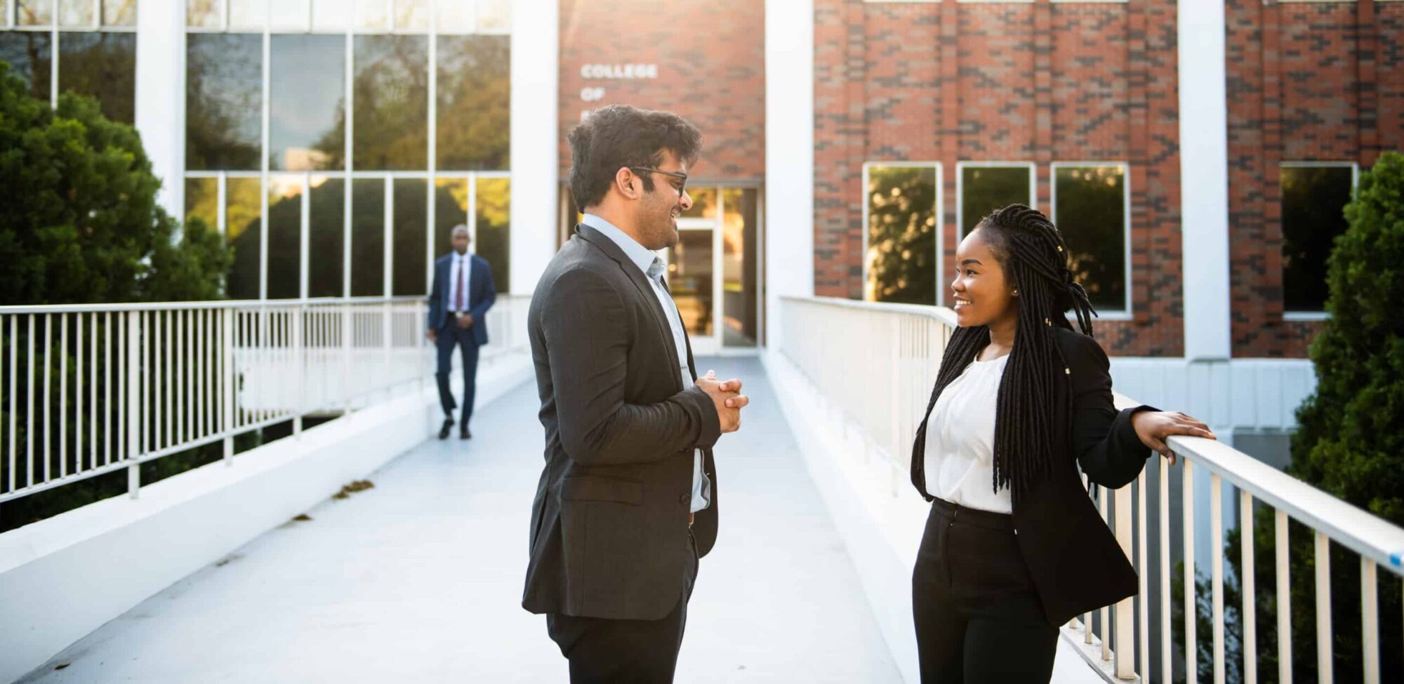 Students interacting to each other outside BA building