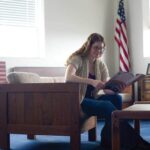 Samantha Lamping reading a book at veterans lounge