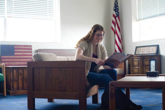 Samantha Lamping reading a book at veterans lounge