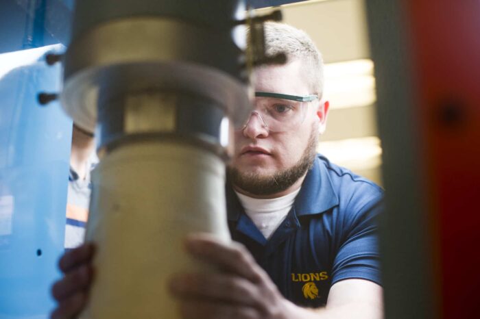 Engineering student working with equipment