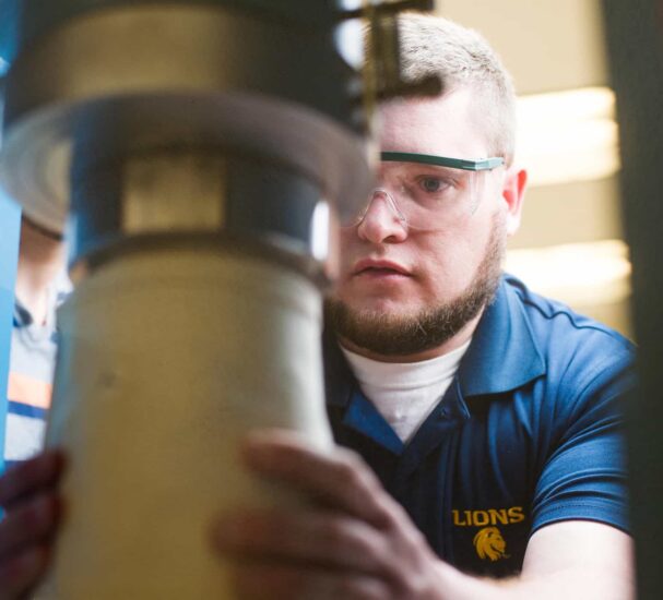 Student working on machinery