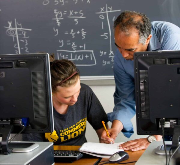 Math professor helping student