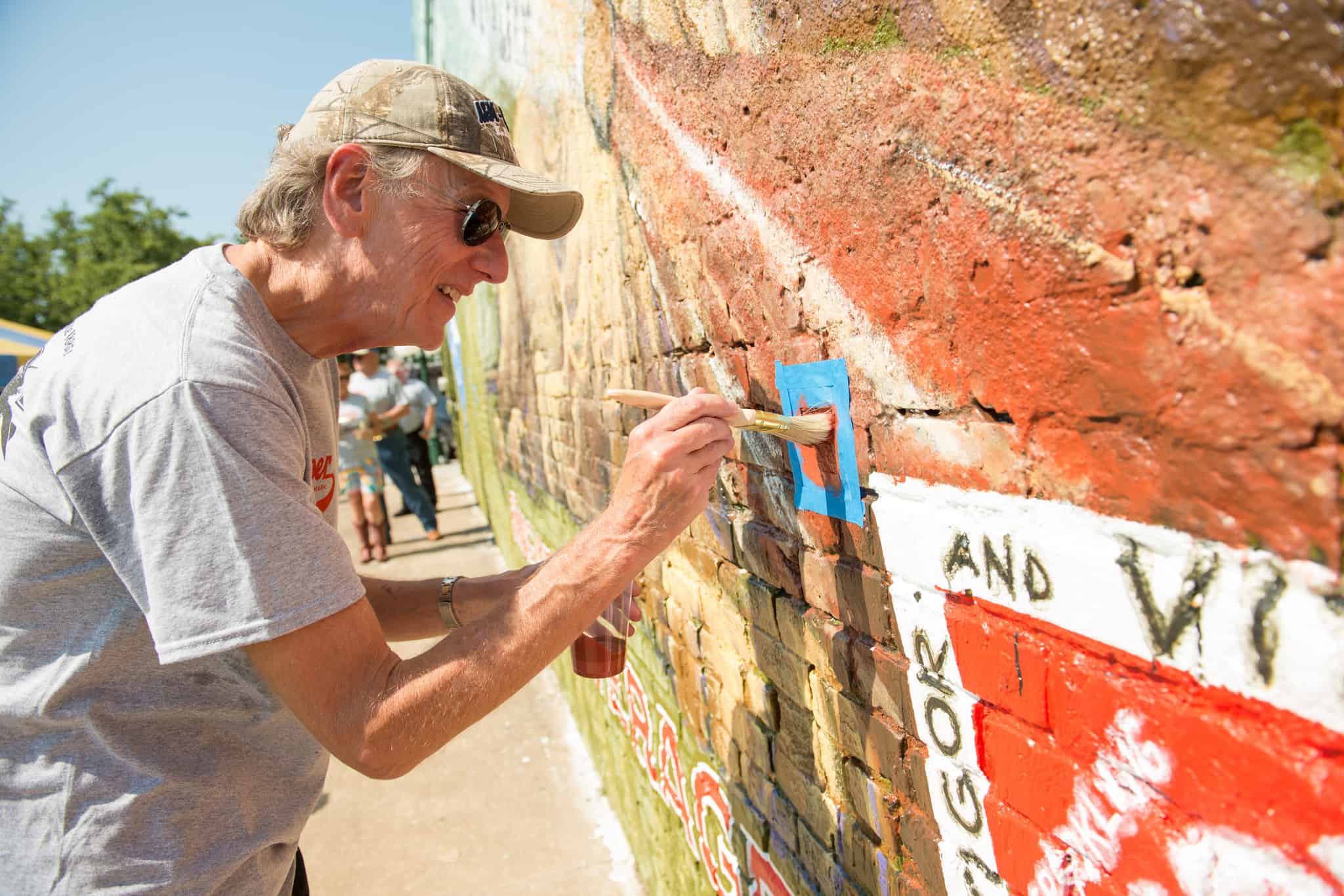 President Dan R. Jones adds his finishing touch.