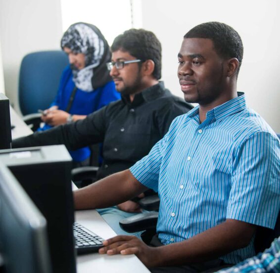 Computer science students working at computers