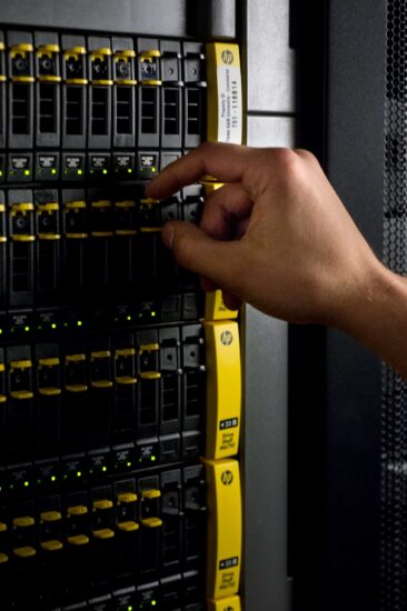 Industrial rack of hard drives being maintained