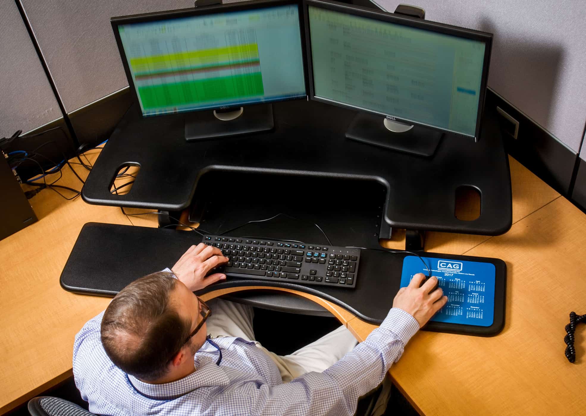 Computer scientist working at several monitors