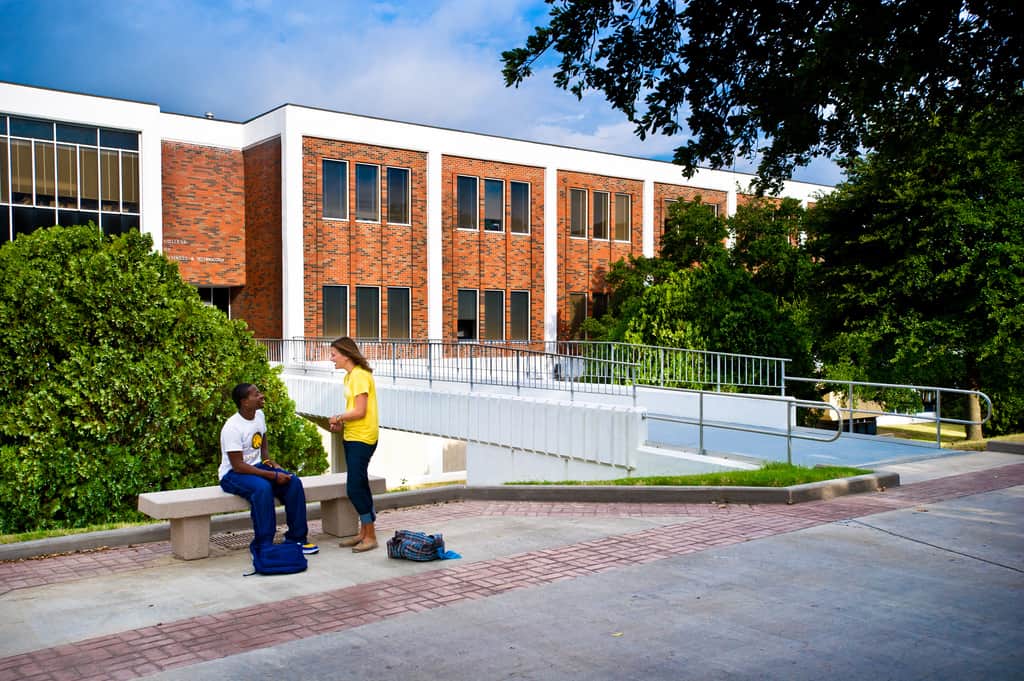 students interacting background 'McDowell Administration Building'