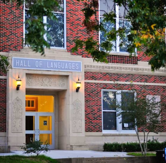 In front of the Hall of Language brick building.