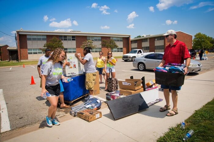 Lion Movers helping a family with move-in|Welcome to Pride Rock!|Pride Rock Move-In|President Jones & Dr. Mary Hendrix Chat with Students|Lion Movers Assisting Families|Student Moving In at Pride Rock|Carts Full on Move-In Day