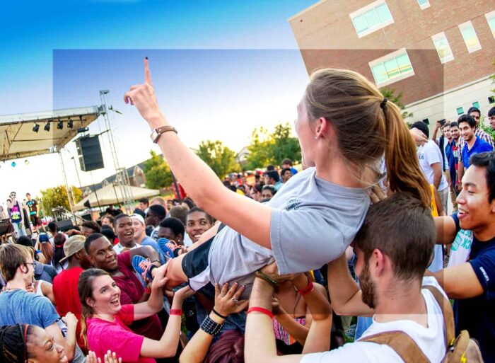 A girl people surfing at an event.