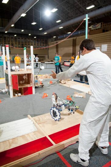 person operating robot at robotics game day