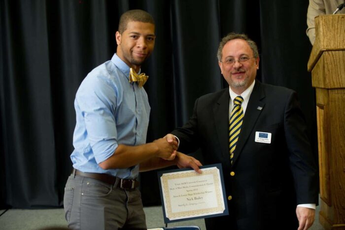 Nick Bailey receiving scholarship winner