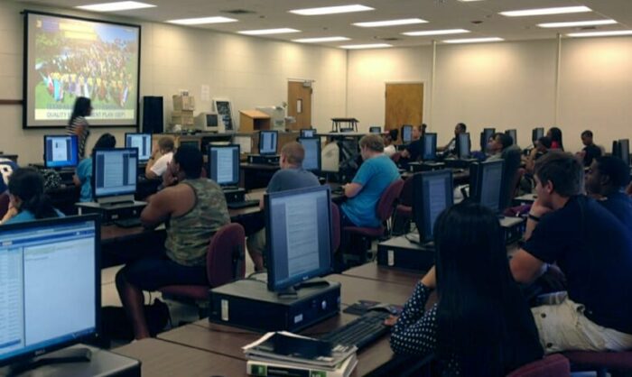 students watching to the professor presentation