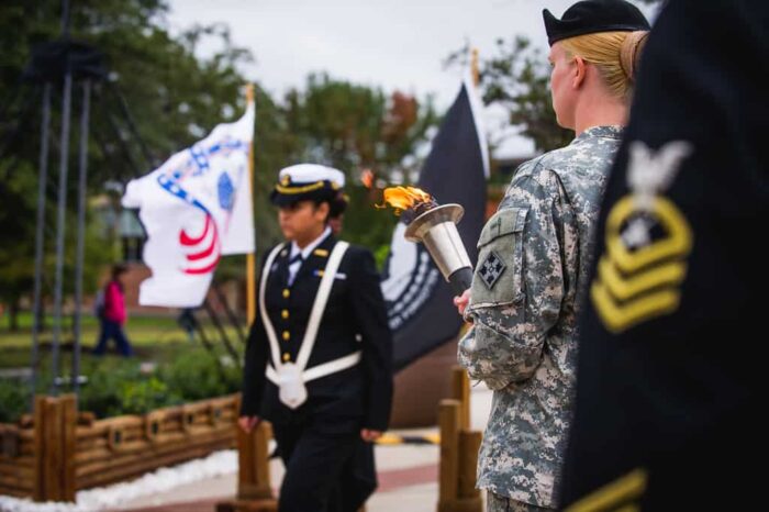 Veterans ceremony and two flags around