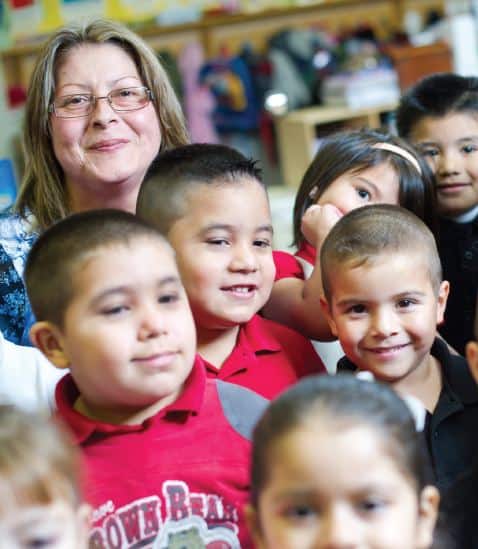 Maria Ruelas at LP Waters Early Childhood Center with kids