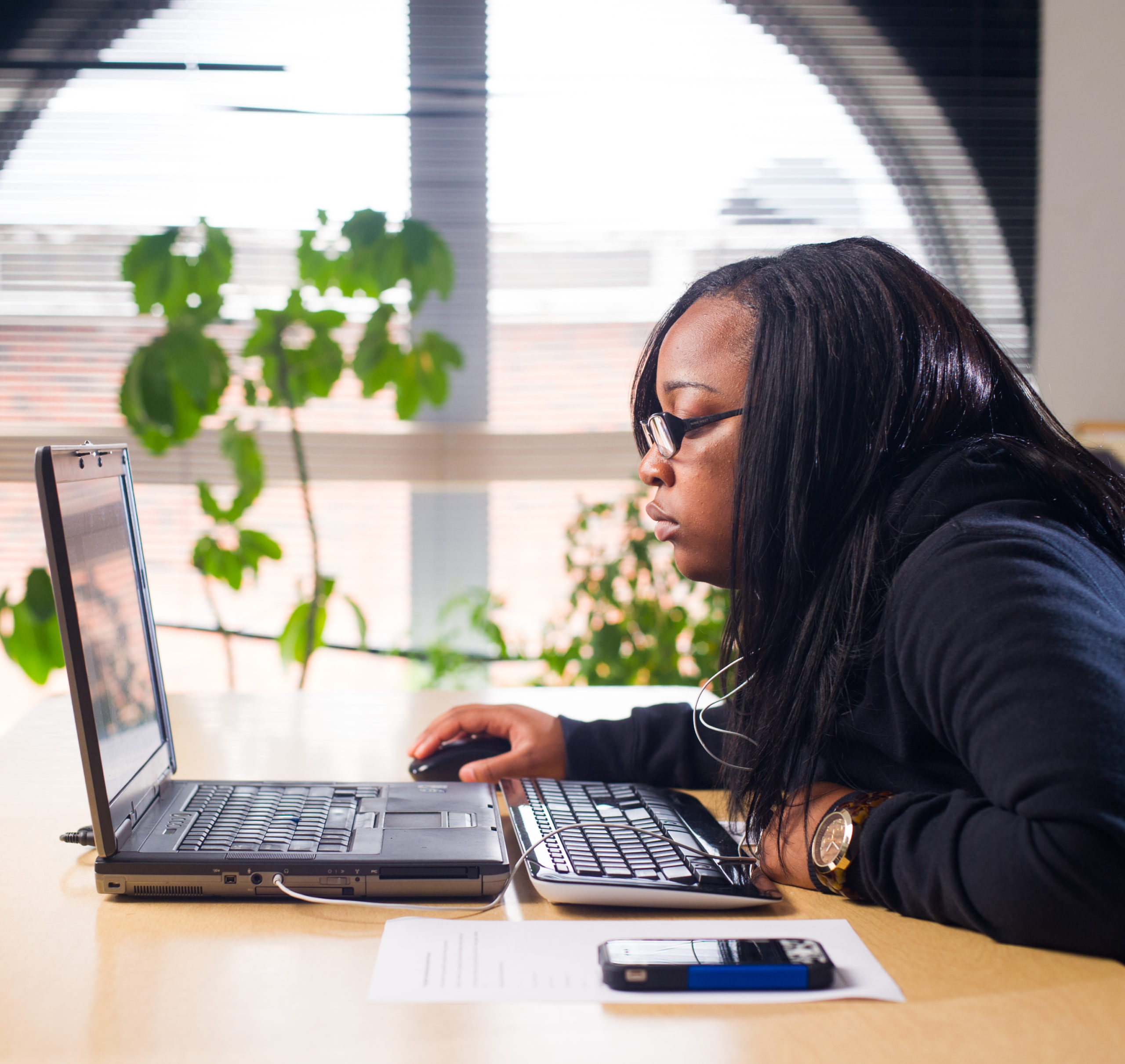 Woman studying at a computer.