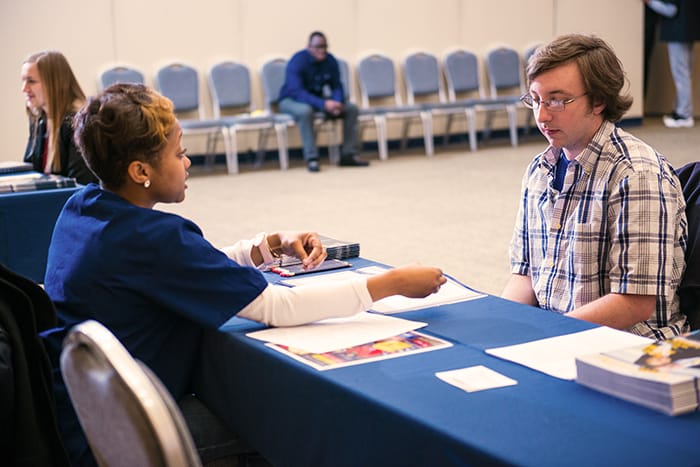 A student talking to a health professional.