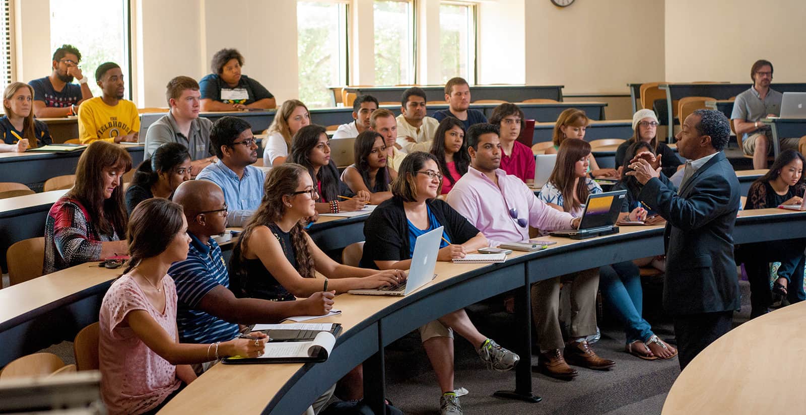 A professor lecturing to a group of students.