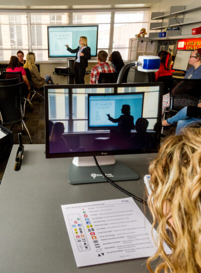 Woman teaching class about special education.