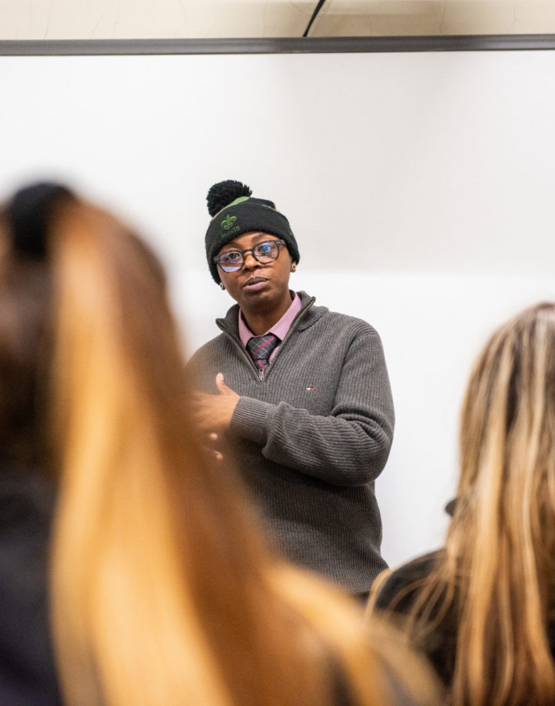 Public health professional speaking to a class.