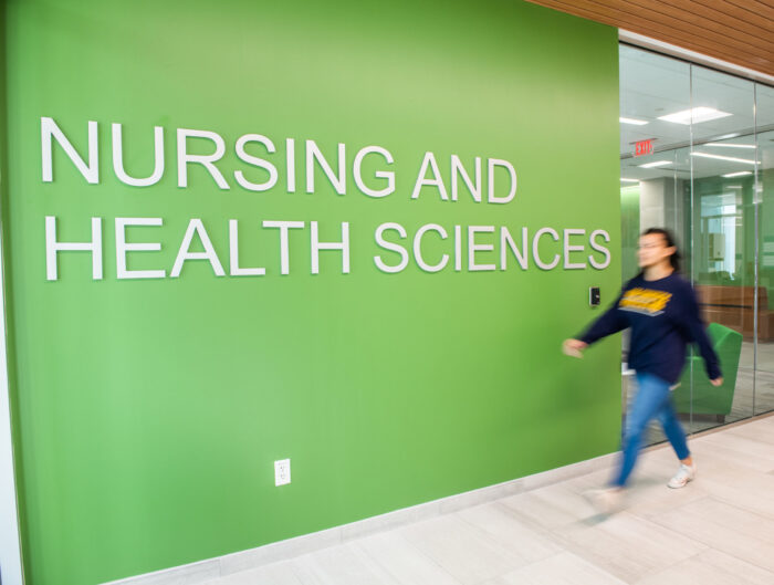 Nursing and Health Sciences sign inside the new health sciences building.