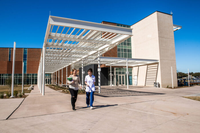 Students departing nursing and health sciences building.