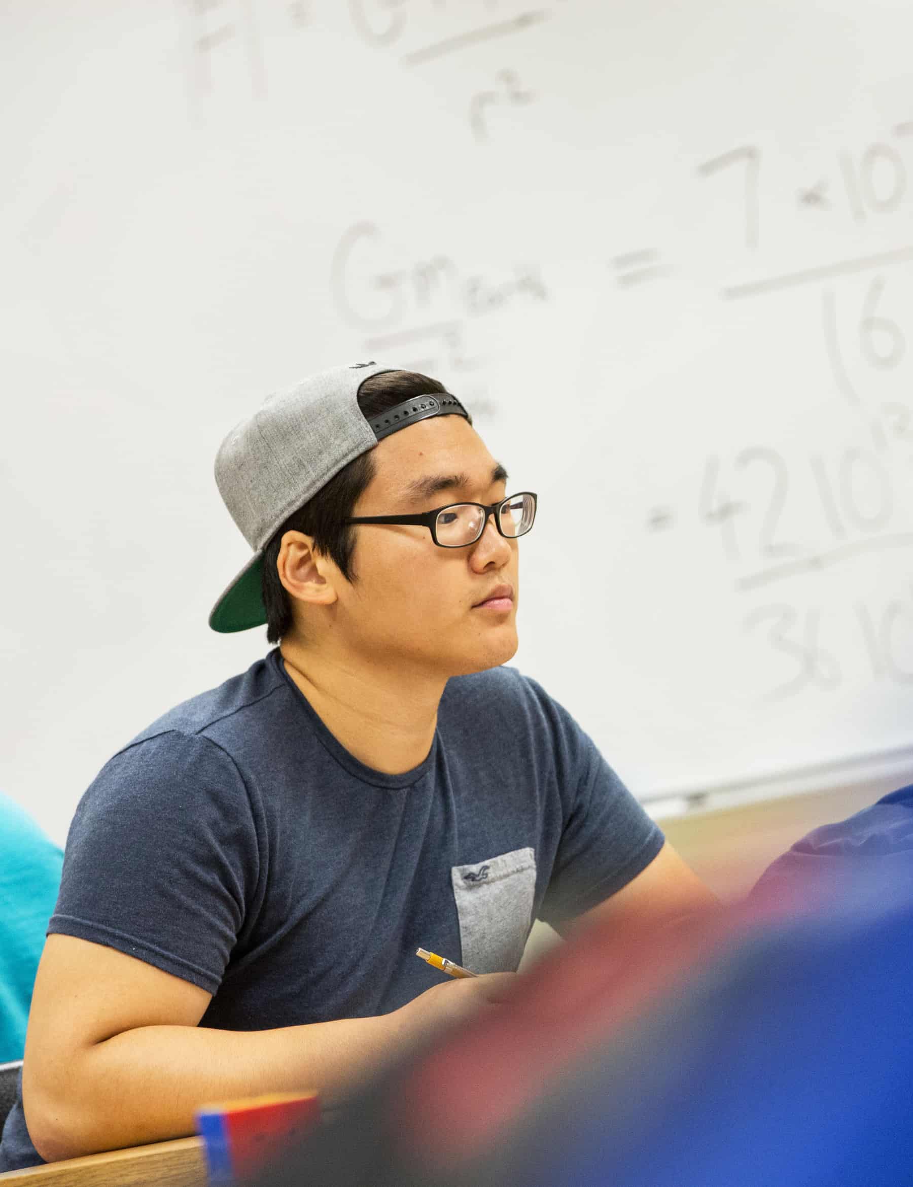 Math student looking at material