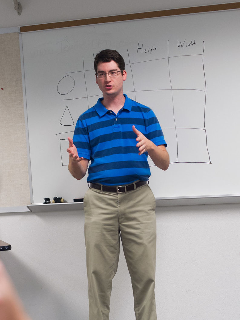 Man teaching a high school classroom.