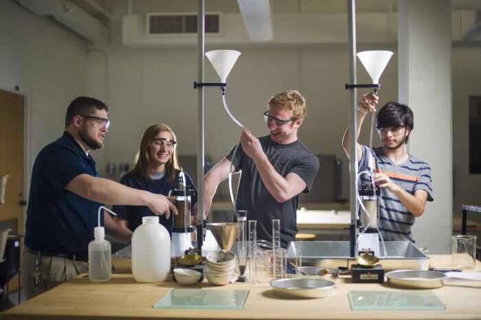 Student preforming lab experiment.