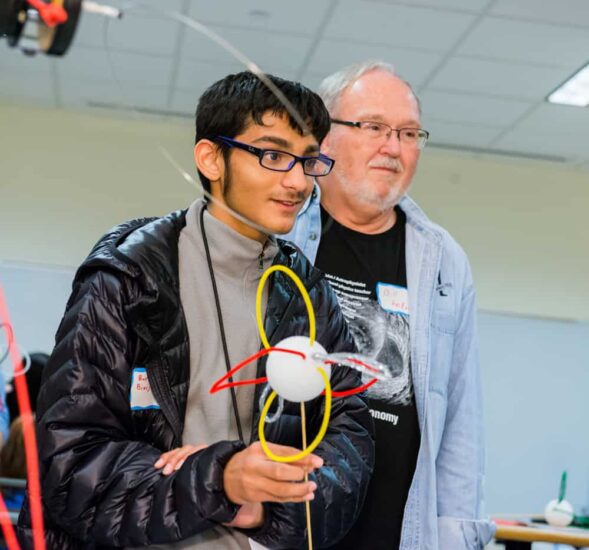 Student carrying science project.