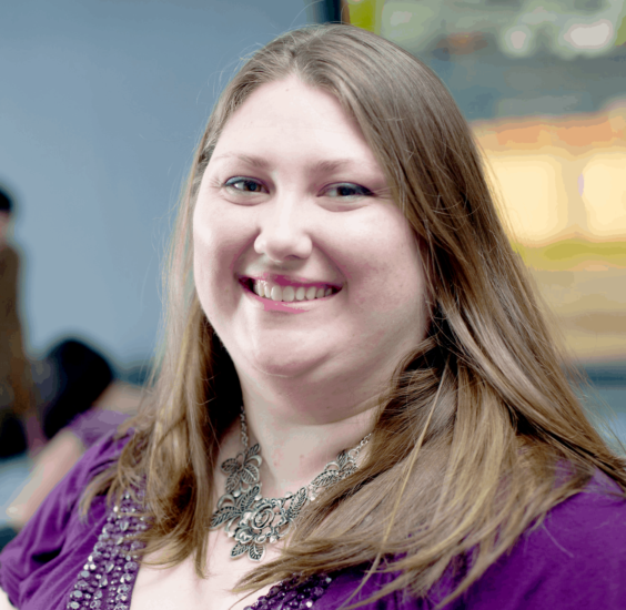 Photo of female in purple blouse.