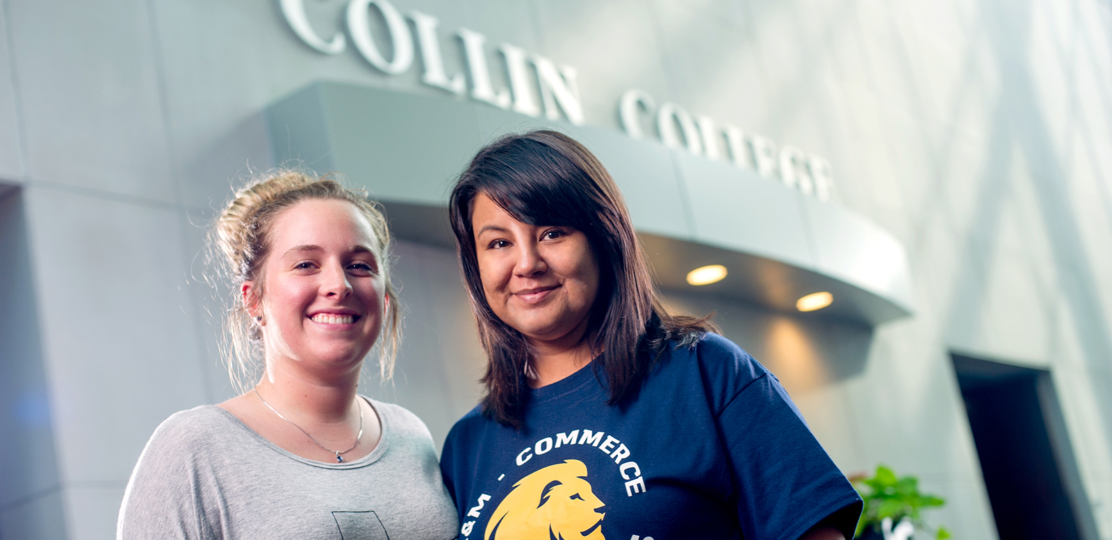 Two females smiling at the camera.