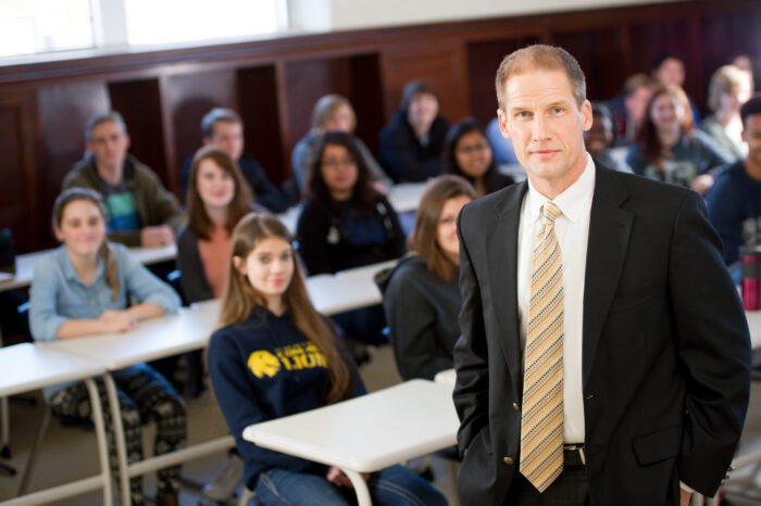 Ricky Dobbs history professor standing in front of class.